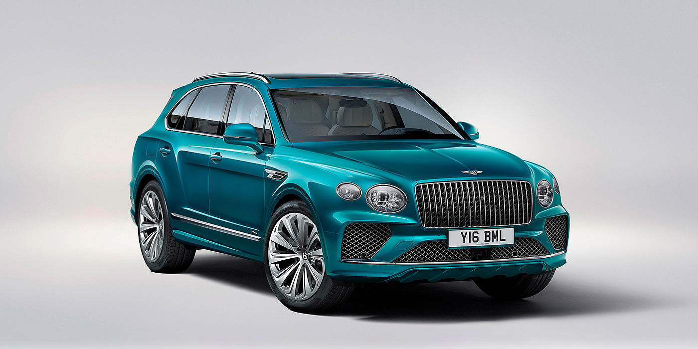Bentley Hatfield Bentley Bentayga Azure front three-quarter view, featuring a fluted chrome grille with a matrix lower grille and chrome accents in Topaz blue paint.