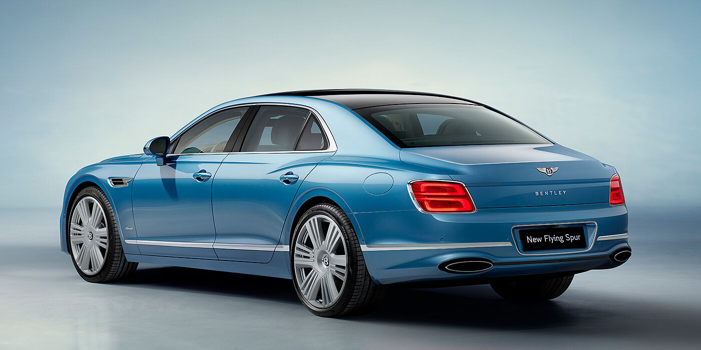 Bentley Hatfield New Bentley Flying Spur Azure sedan rear view in Light windsor blue by Mulliner paint with 22 inch Azure wheels and chrome exterior details