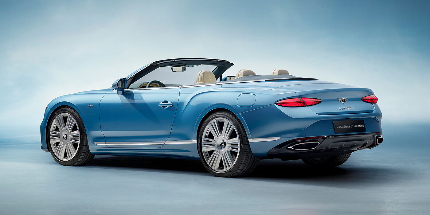 Bentley Hatfield New Bentley Continental GTC Azure convertible rear view in Light Windsor blue paint with 22 inch ten spoke wheels and chrome exterior details