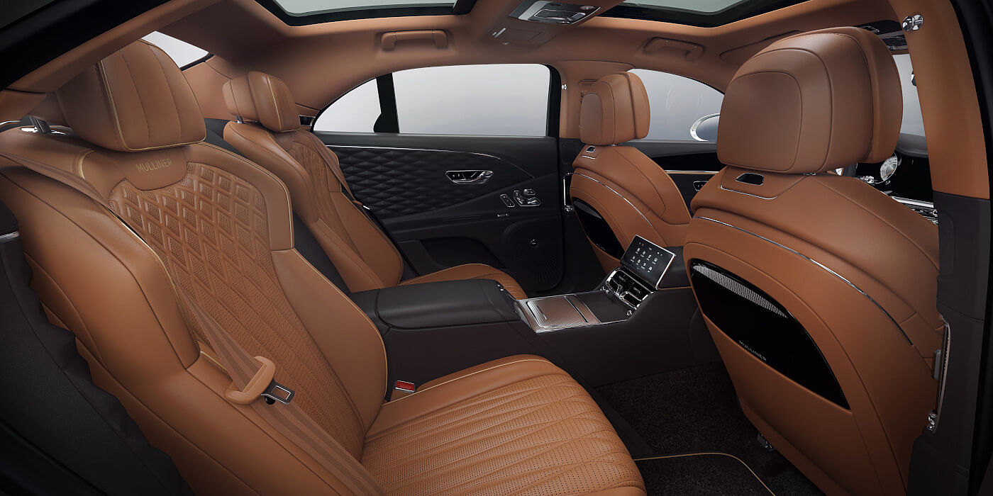 Bentley-Flying-Spur-Hybrid-Mulliner-rear-interior-in-Newmarket-Tan-and-Imperial-Blue-hides-and-3D-diamond-leather-door