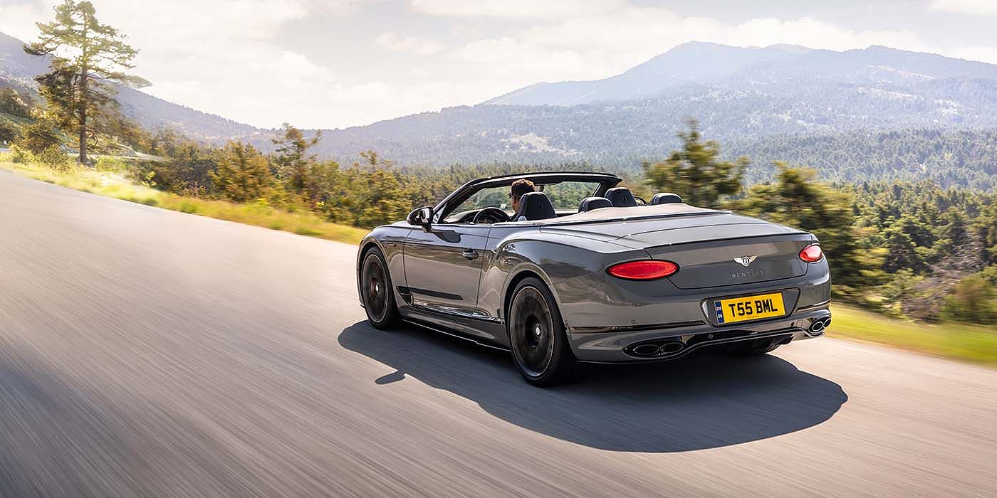Bentley Hatfield Bentley Continental GTC S convertible in Cambrian Grey paint rear 34 dynamic driving