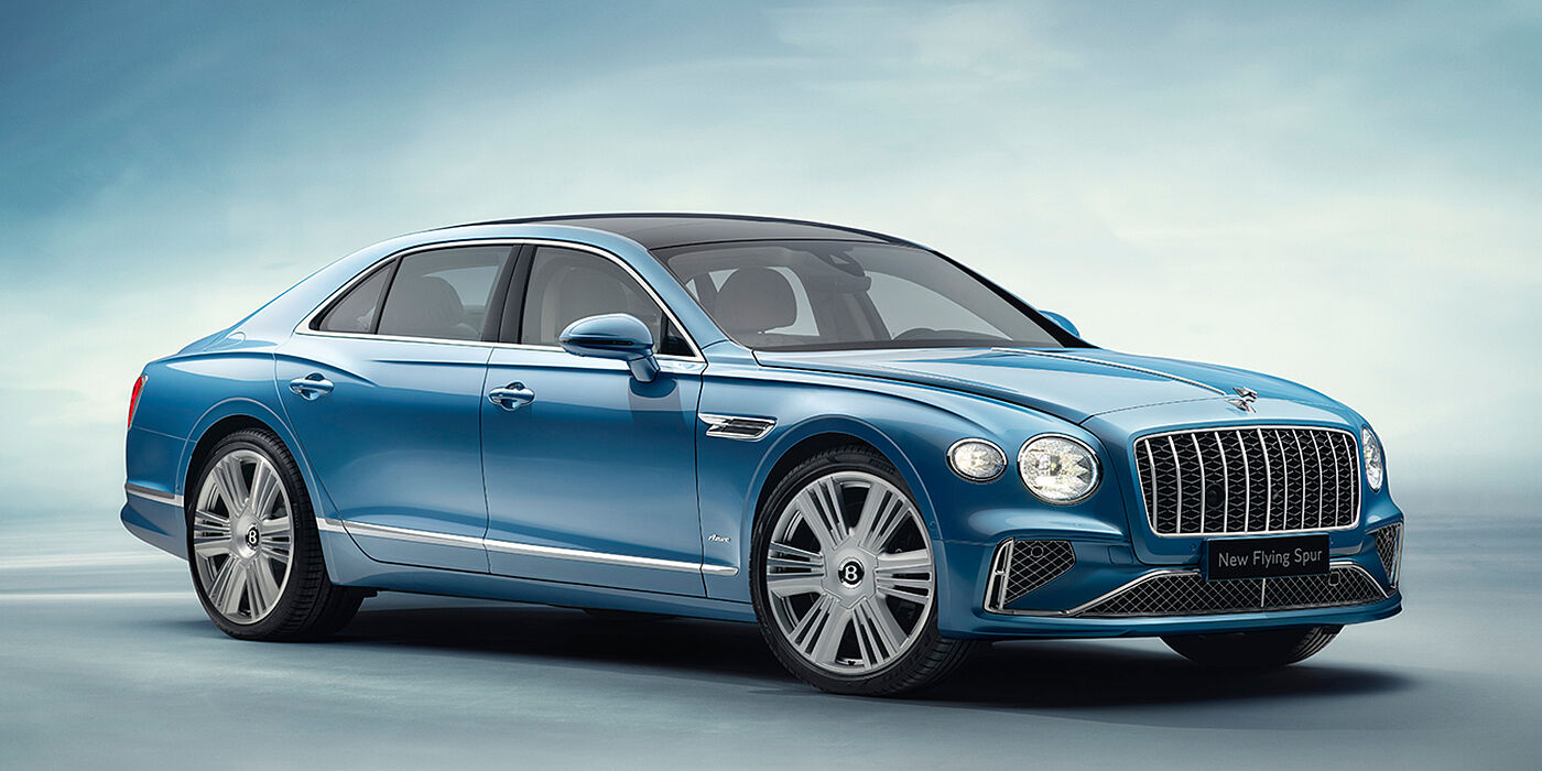 Bentley Hatfield New Bentley Flying Spur Azure sedan front view in Light windsor blue by Mulliner paint with 22 inch Azure wheels and chrome exterior details
