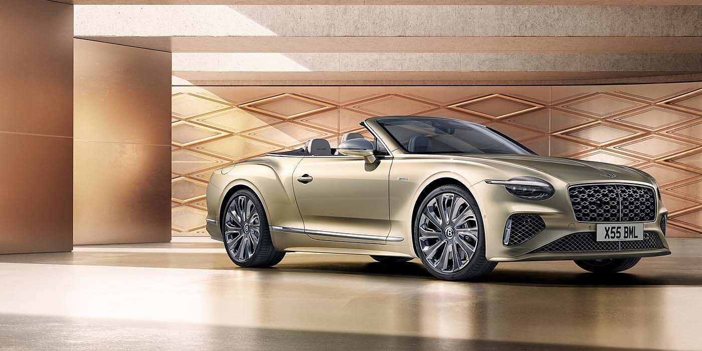 Bentley Hatfield Bentley New Continental GTC Mulliner V8 hybrid front three quarters in Patina paint