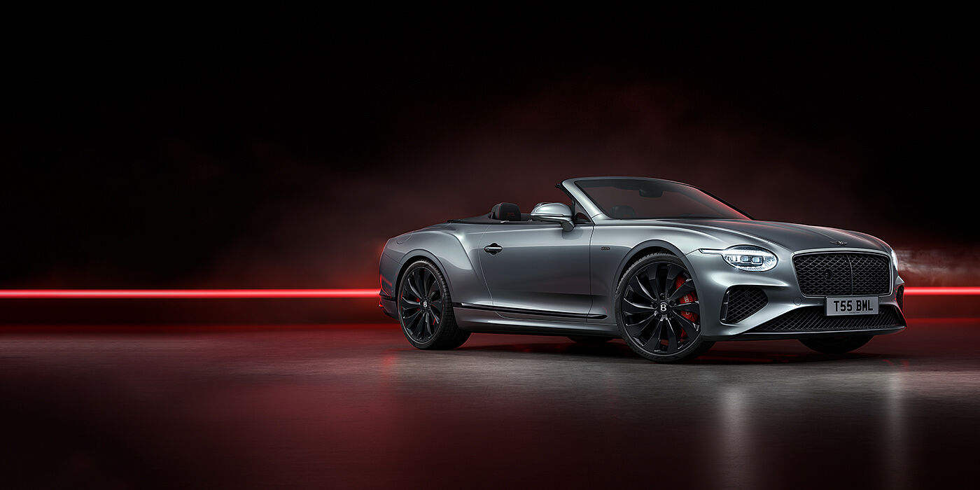 Bentley Hatfield Bentley Continental GTC Black Edition convertible front three quarters in Hallmark silver against a dark grey and red background