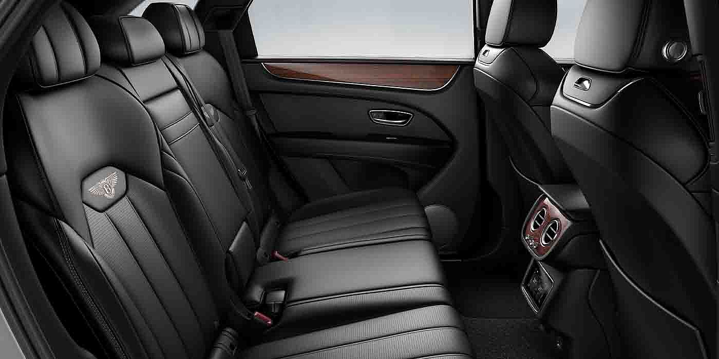 Bentley Hatfield Bentley Bentayga EWB interior view for rear passengers with Beluga black hide.