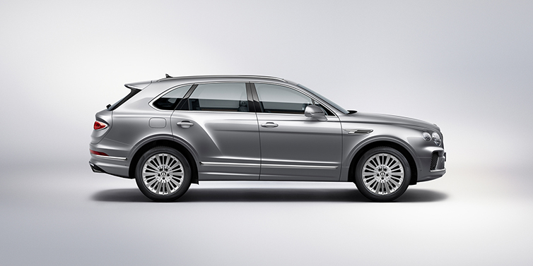 Bentley Hatfield Bentley Bentayga SUV side profile in Moonbeam silver paint against white background featuring 21 inch 5 spoke wheels