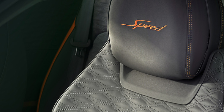 Bentley Hatfield Bentley Continental GT Speed coupe seat detail in Gravity Grey hide and Speed emblem in Mandarin by Mulliner coloured embroidery