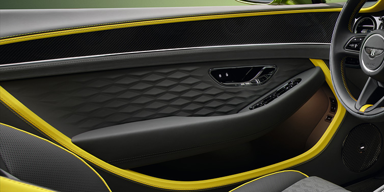 Bentley Hatfield Bentley Continental GTC Speed convertible interior door details featuring Gravity Grey and Cyber Yellow by Mulliner hides and high gloss carbon fibre veneer