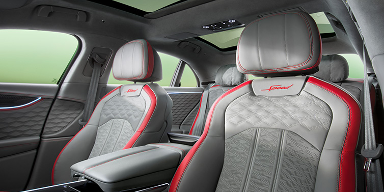 Bentley Hatfield Bentley Flying Spur Speed sedan interior showing front and rear seats in Hotspur red and Gravity Grey hides, with Speed seat emblems