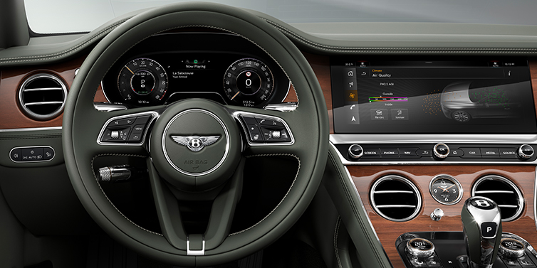 Bentley Hatfield New Bentley Continental GT coupe steering wheel and front cabin view in Cumbrian Green hide and Crown Cut walnut veneer